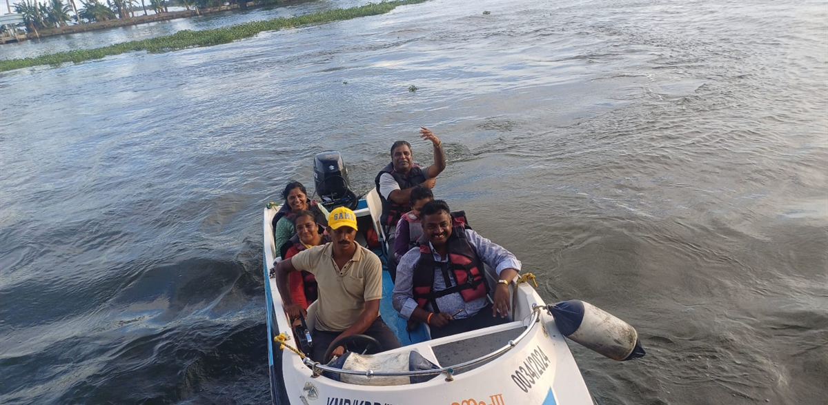 Guests on a small boat on the Kerala backwaters