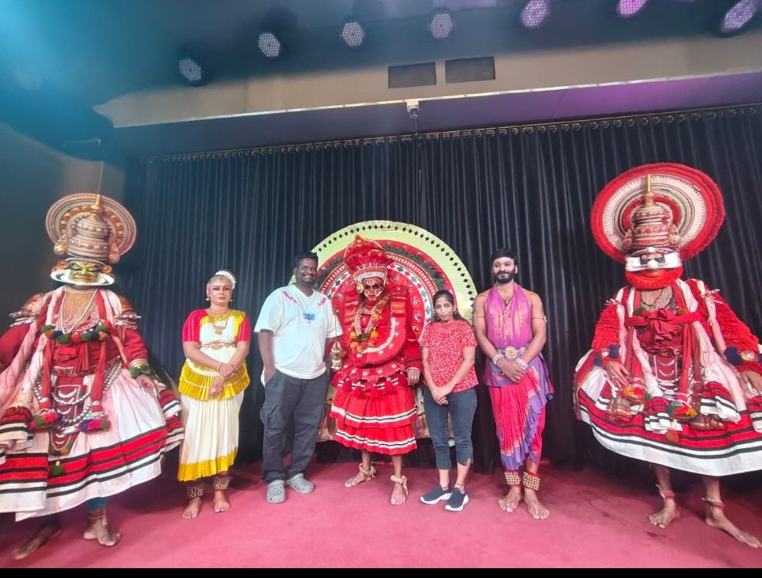 Guests with Kathakali performers in Kerala